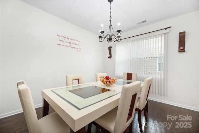 dining area with baseboards, visible vents, and dark wood-type flooring