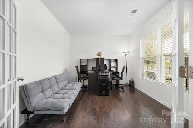 office with visible vents, baseboards, and dark wood-type flooring