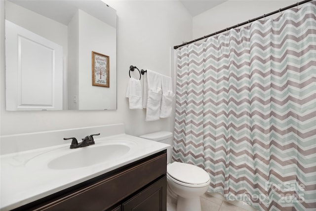 bathroom with vanity, curtained shower, toilet, and tile patterned flooring