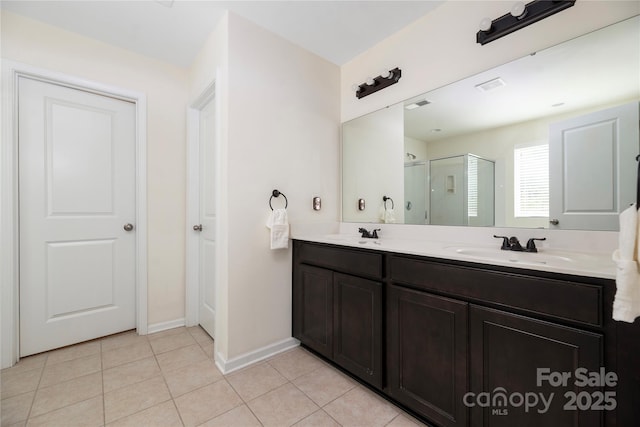 bathroom with double vanity, visible vents, a sink, tile patterned flooring, and a shower stall