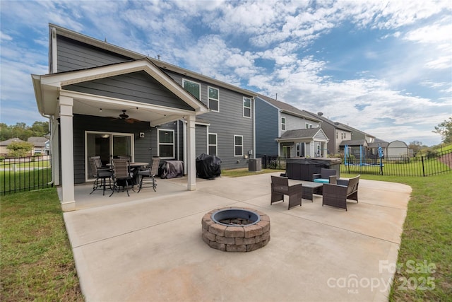 view of patio / terrace with a ceiling fan, a fenced backyard, area for grilling, and a fire pit