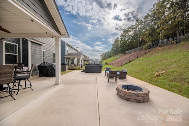 view of patio / terrace featuring grilling area, an outdoor fire pit, and a fenced backyard