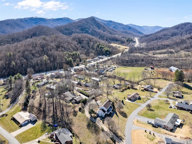 bird's eye view with a mountain view and a wooded view