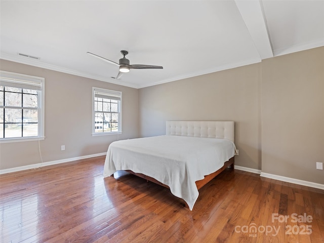 bedroom featuring hardwood / wood-style flooring, baseboards, and visible vents