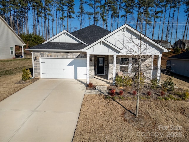 view of front of property with a shingled roof, an attached garage, board and batten siding, stone siding, and driveway