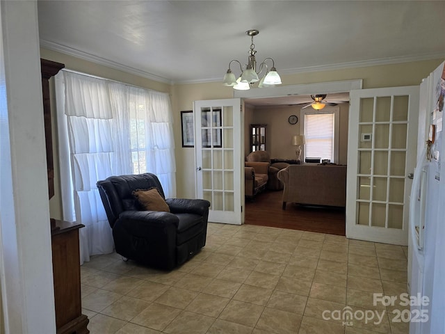 living area featuring light tile patterned floors, ornamental molding, an inviting chandelier, and french doors