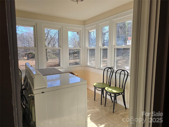 laundry room featuring light tile patterned floors