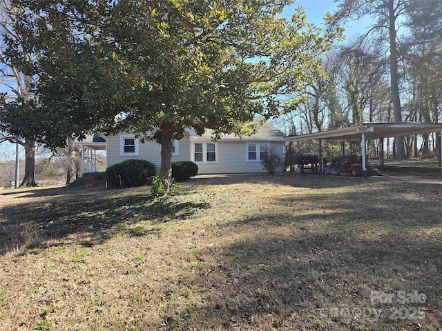 exterior space featuring a carport and an outdoor structure