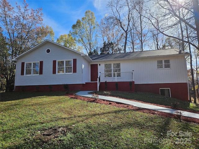 ranch-style home with a front lawn