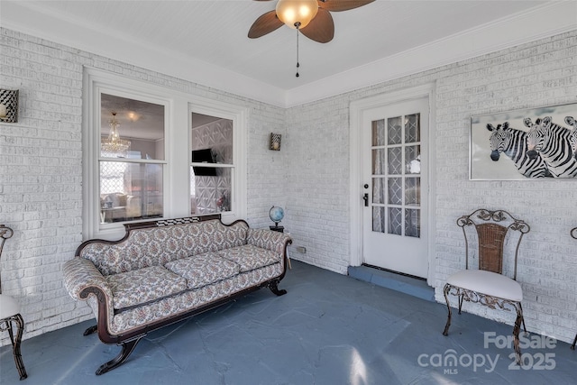 sunroom / solarium featuring ceiling fan