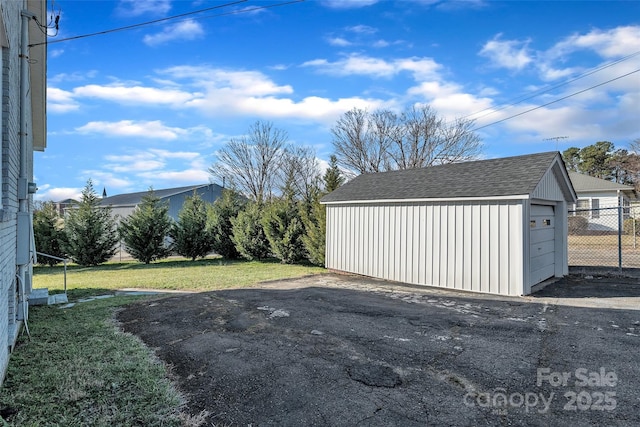 detached garage with fence