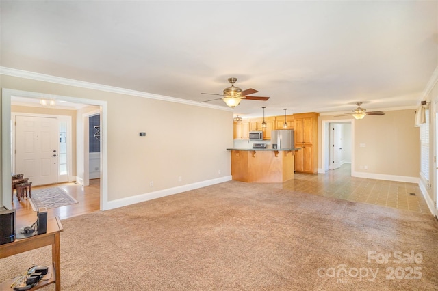 unfurnished living room with light colored carpet, crown molding, and baseboards