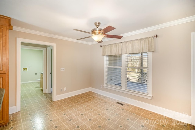 spare room featuring baseboards, visible vents, a ceiling fan, ornamental molding, and light floors