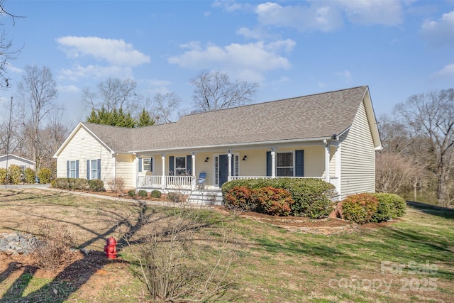 ranch-style home with a front lawn, a porch, and roof with shingles