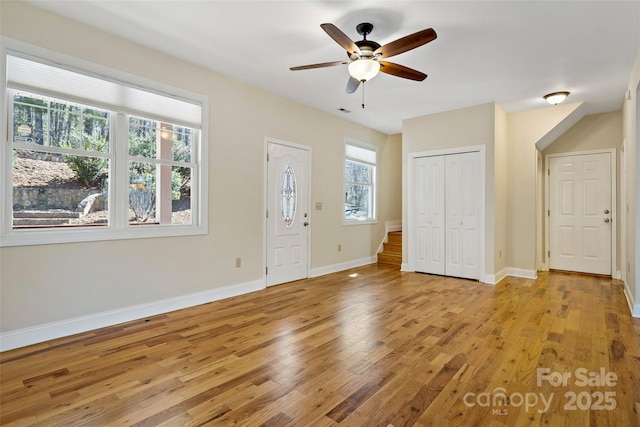 unfurnished bedroom featuring baseboards, ceiling fan, and light wood finished floors