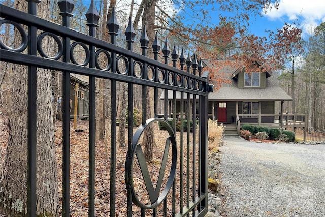 view of gate with covered porch