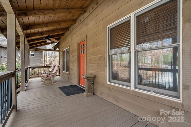 wooden deck with ceiling fan and covered porch