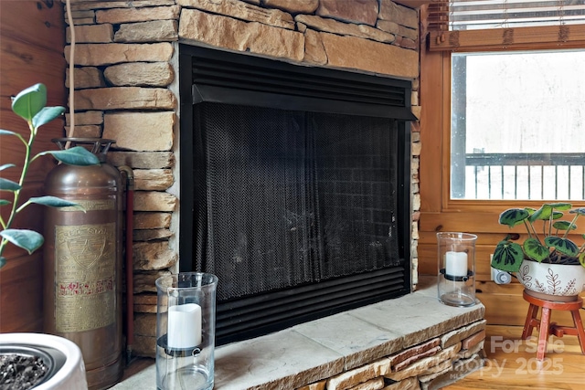 details with a stone fireplace