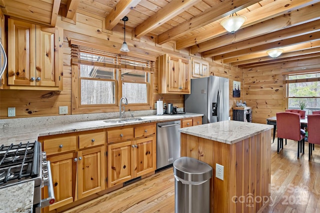 kitchen with stainless steel appliances, a sink, wood ceiling, hanging light fixtures, and light stone countertops