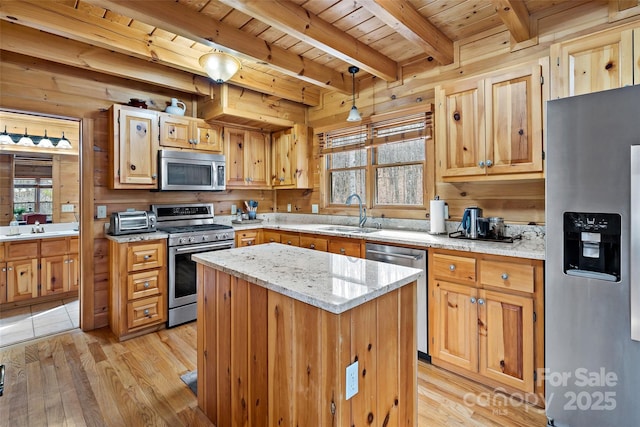 kitchen with wood ceiling, a kitchen island, appliances with stainless steel finishes, hanging light fixtures, and a sink