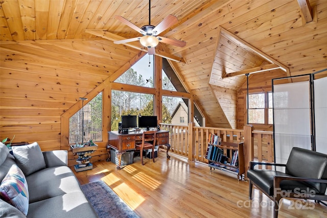 office space featuring light wood finished floors, wood ceiling, and a wealth of natural light