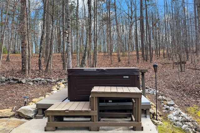 exterior space with a hot tub