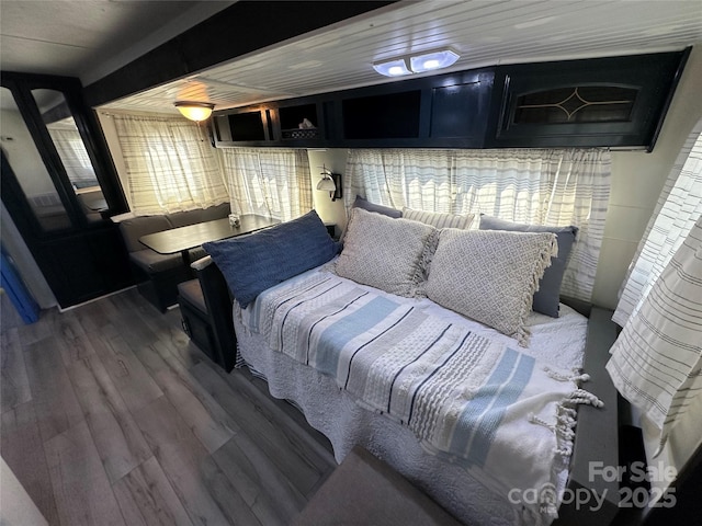 bedroom featuring wood finished floors