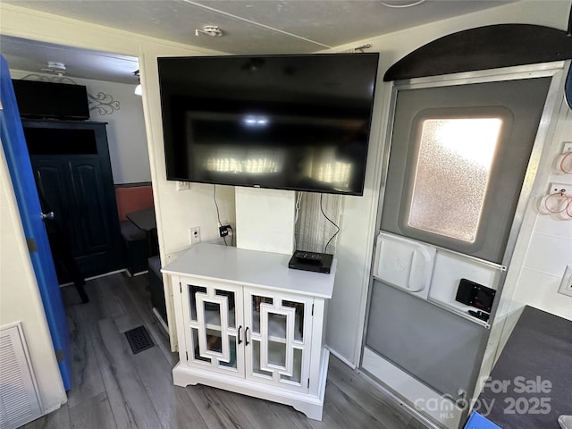 interior space featuring dark wood finished floors and visible vents