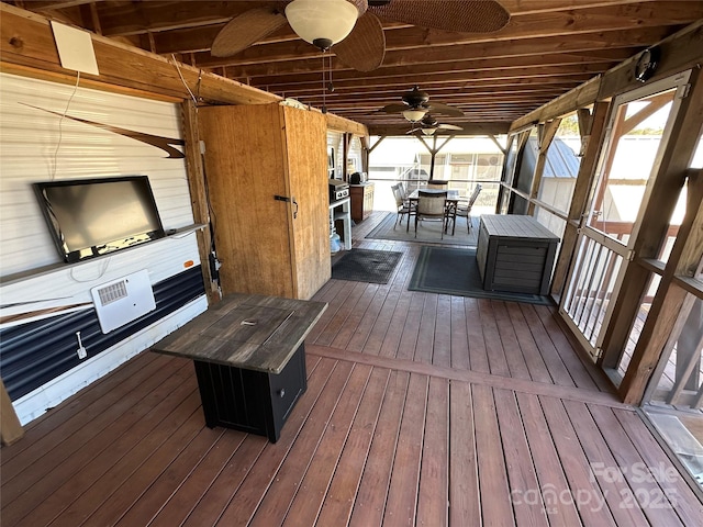 wooden deck with outdoor dining area