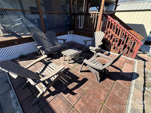 deck featuring stairway and a patio area