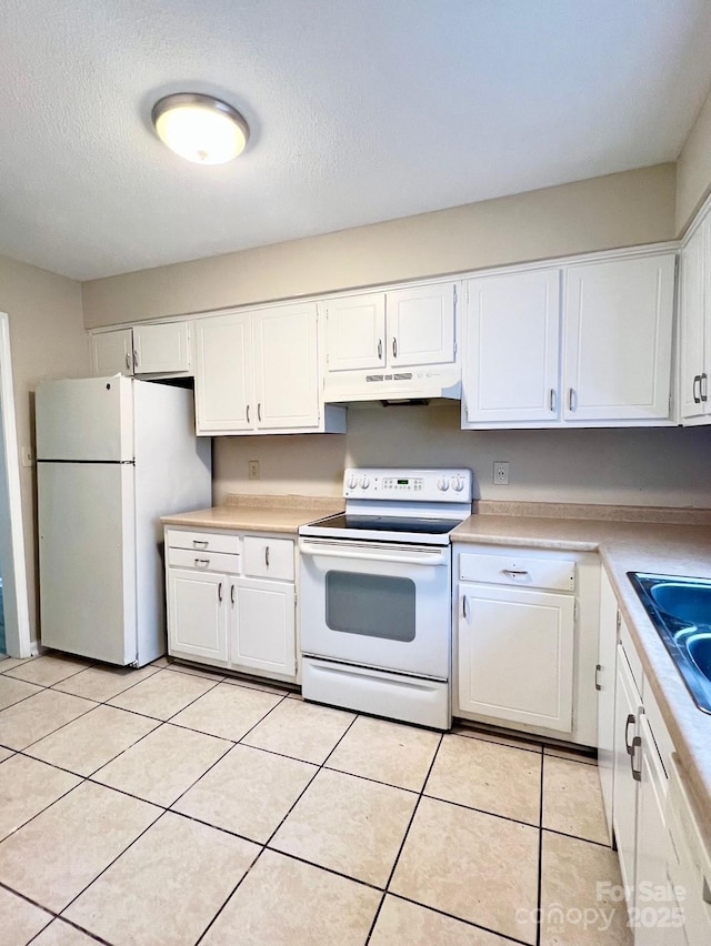 kitchen with light countertops, white cabinets, a sink, white appliances, and under cabinet range hood