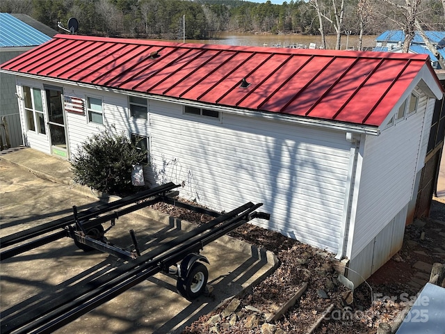 exterior space featuring a standing seam roof and metal roof