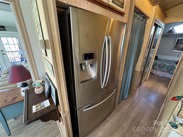 117 Badin Lake Cir, New London, NC 28127 - kitchen featuring wood finished floors and stainless steel fridge with ice dispenser