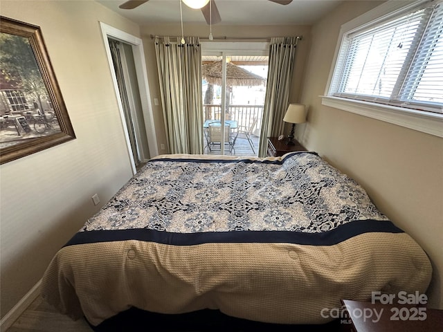 117 Badin Lake Cir, New London, NC 28127 - bedroom with a ceiling fan, access to outside, and multiple windows