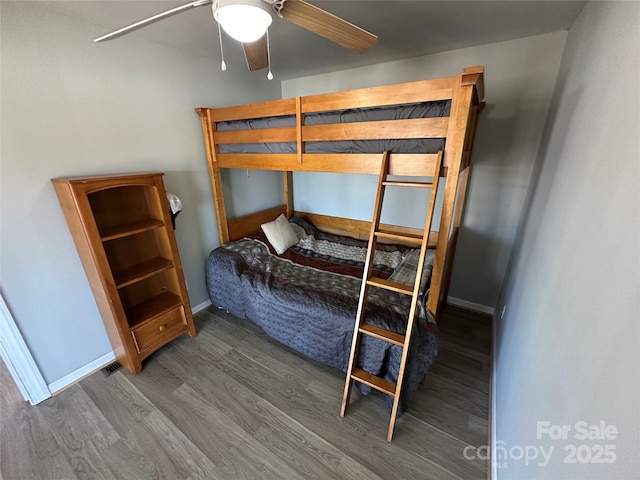 117 Badin Lake Cir, New London, NC 28127 - bedroom with ceiling fan, wood finished floors, and baseboards