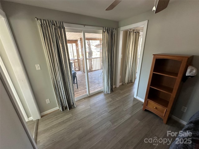 117 Badin Lake Cir, New London, NC 28127 - unfurnished bedroom featuring access to exterior, a ceiling fan, baseboards, and wood finished floors