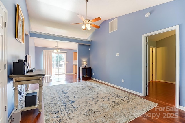 living area featuring baseboards, visible vents, a ceiling fan, dark wood-type flooring, and vaulted ceiling