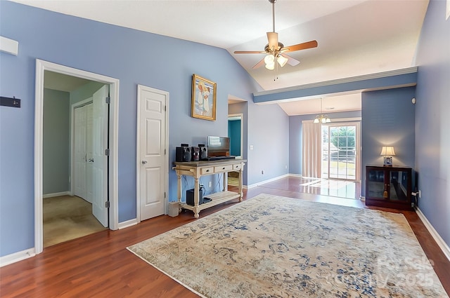 interior space featuring dark wood-style floors, lofted ceiling, baseboards, and a ceiling fan