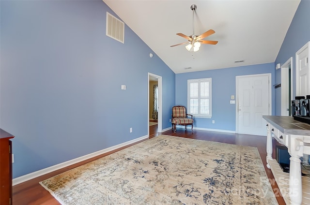 living area with dark wood-style flooring, visible vents, ceiling fan, and baseboards