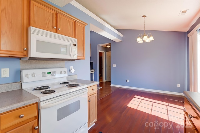 kitchen with a chandelier, white appliances, visible vents, light countertops, and dark wood finished floors