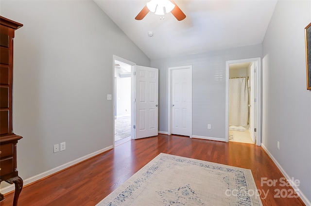 bedroom with a ceiling fan, vaulted ceiling, baseboards, and wood finished floors