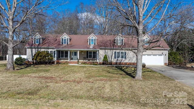 cape cod home with a porch, a front yard, concrete driveway, and a garage