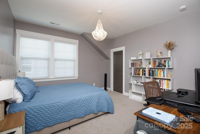 bedroom featuring baseboards, carpet, visible vents, and an inviting chandelier