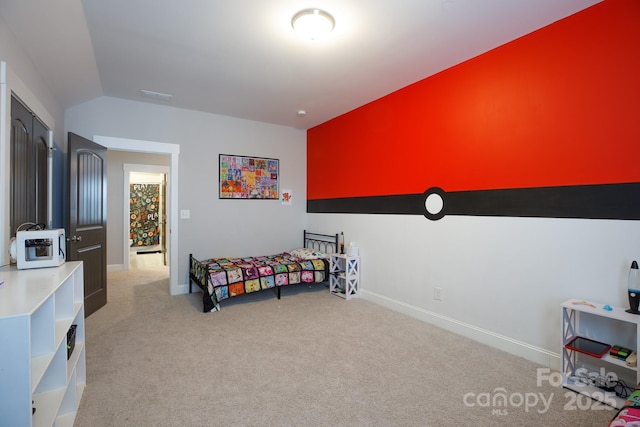 bedroom with light carpet, baseboards, and vaulted ceiling