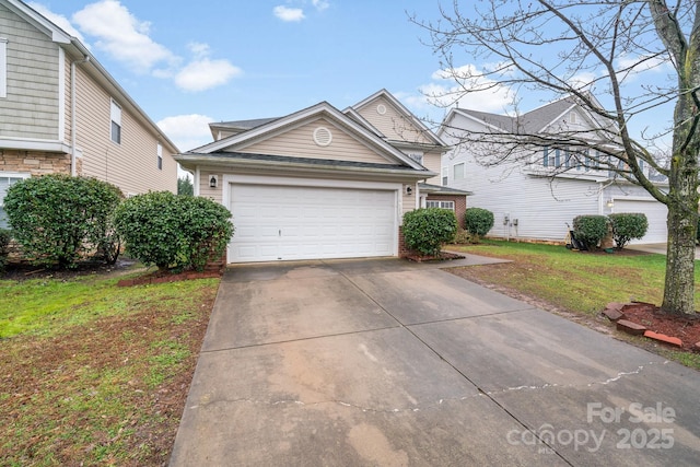 view of front facade with driveway, an attached garage, and a front yard