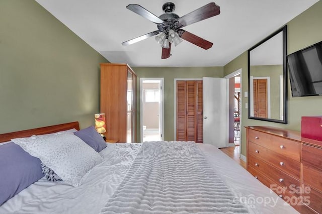 bedroom featuring ceiling fan, a closet, and connected bathroom