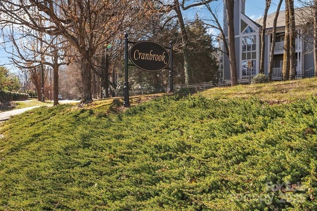 community / neighborhood sign with a lawn