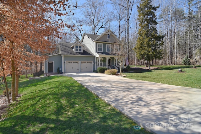 view of front of house with a garage, driveway, a front lawn, and a porch