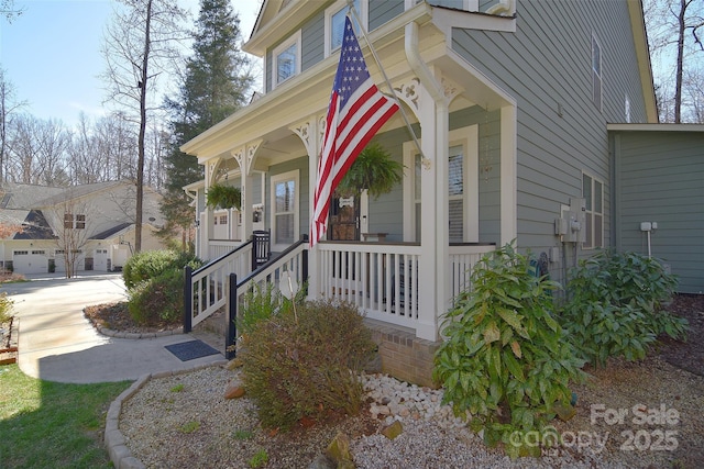 view of exterior entry featuring a porch