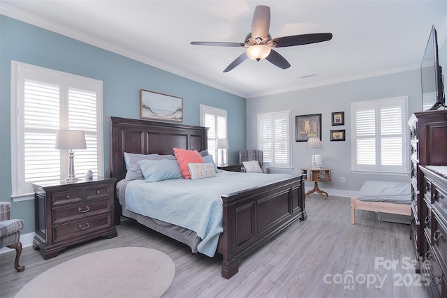 bedroom with light wood finished floors, baseboards, and ornamental molding